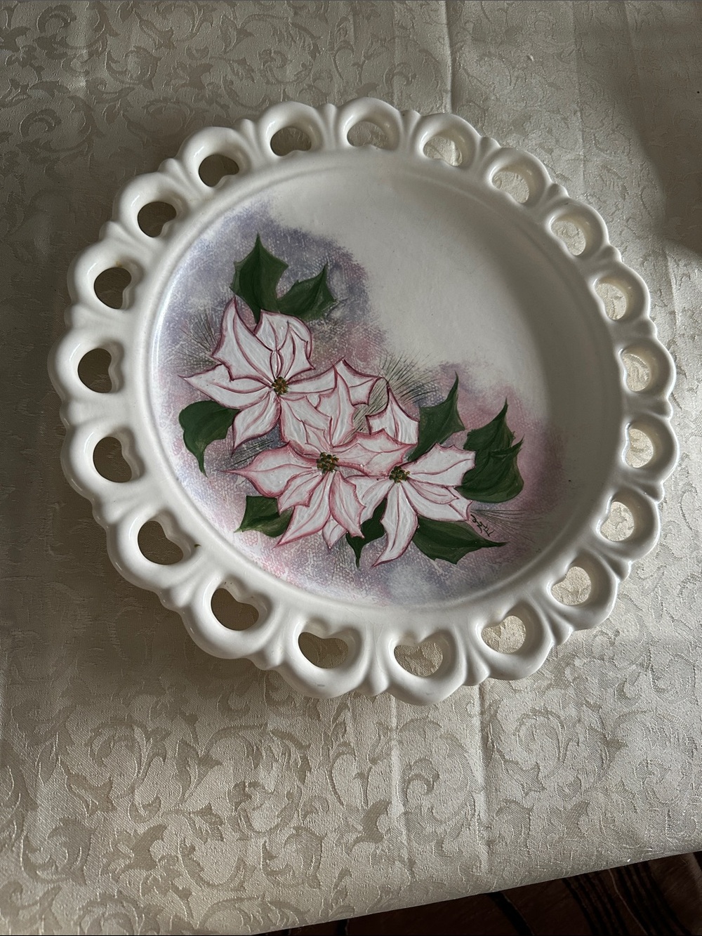 Hand-Painted White Decorative Plate with Pink Poinsettia Motif